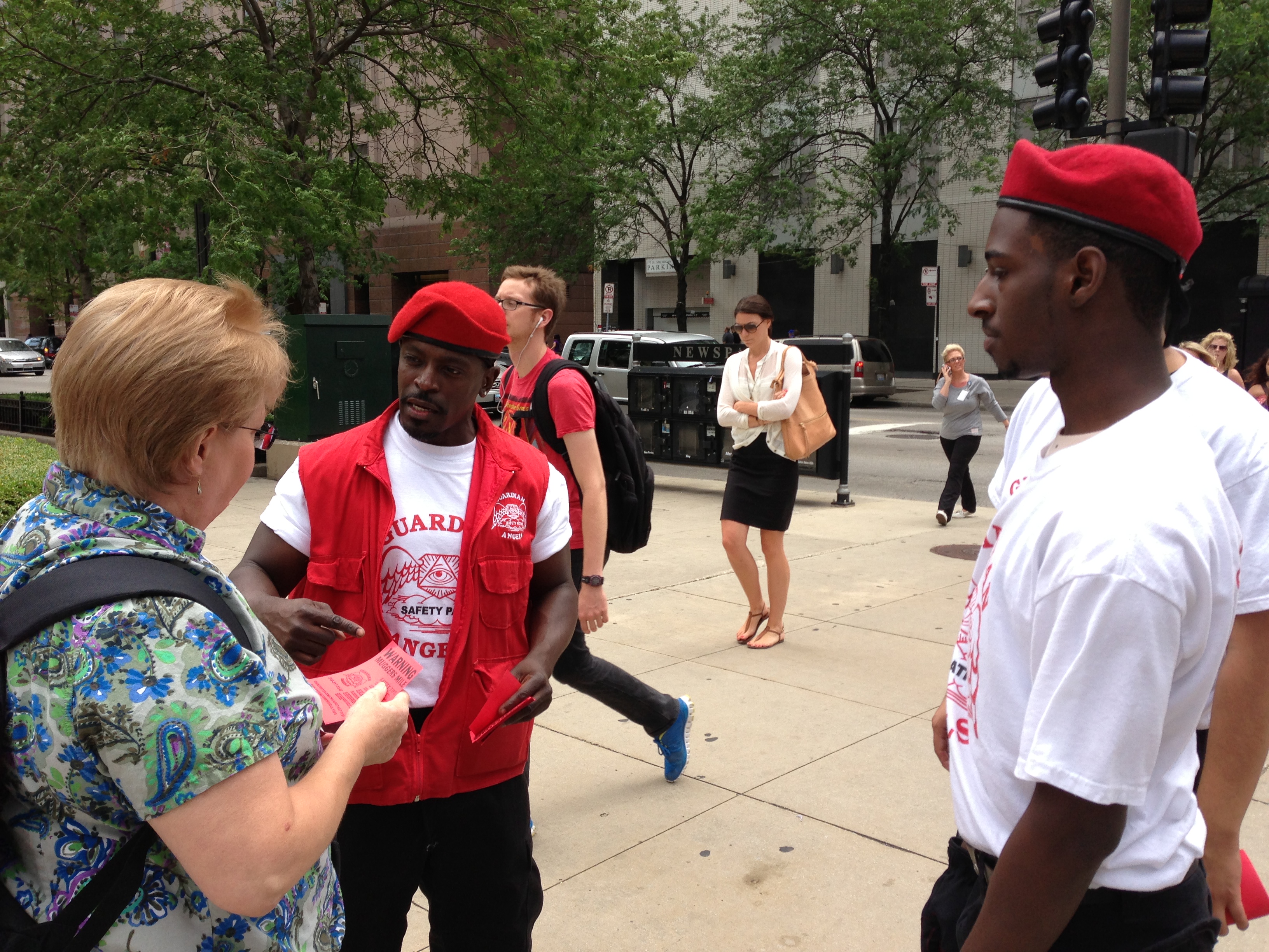 Guardian Angels passing out flyers along Michigan Avenue. (Credit: Steve Miller)