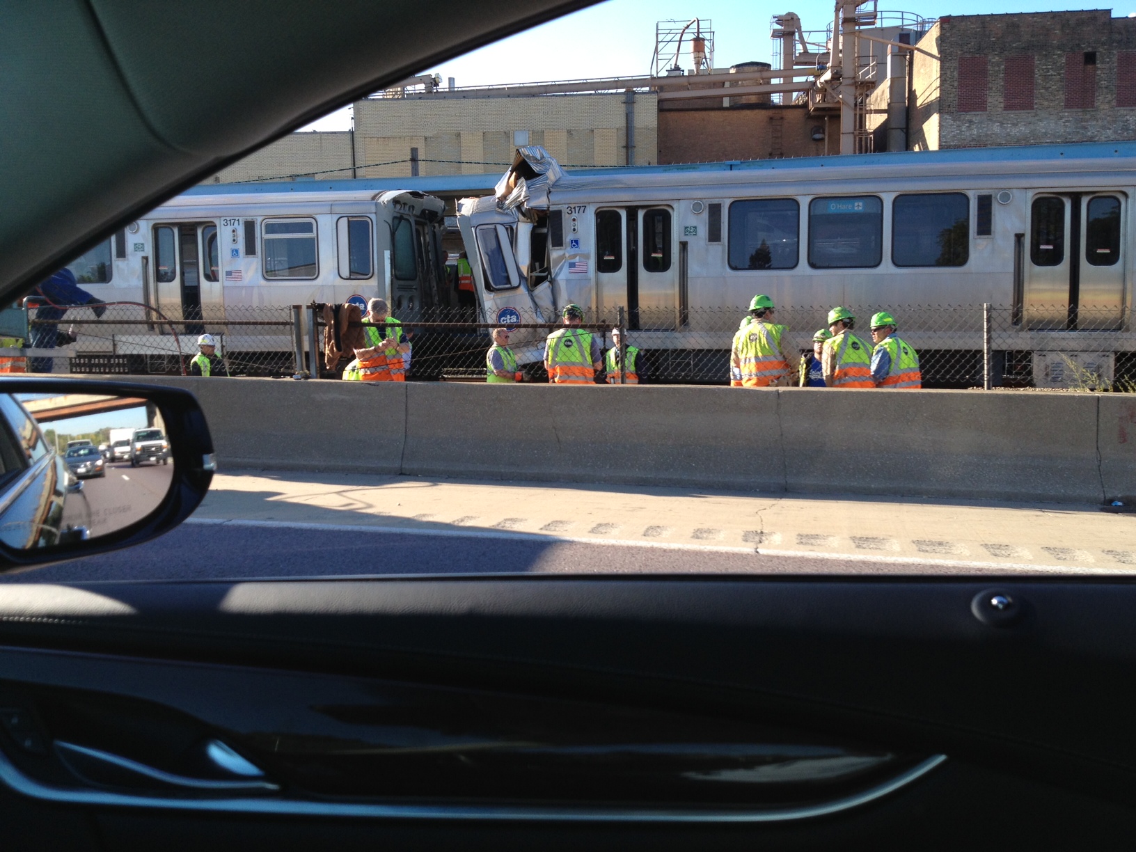 CTA workers respond to an accident on the Blue Line on Monday. (Credit: Michael Biemolt)