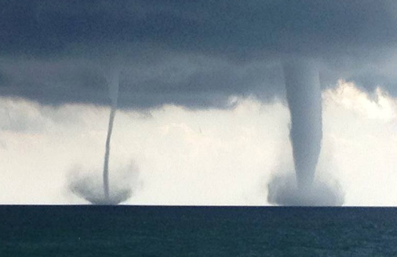 An officer with the Kenosha Police Department took this picture of two waterspouts over Lake Michigan. (Credit: Kenosha Police/Facebook)