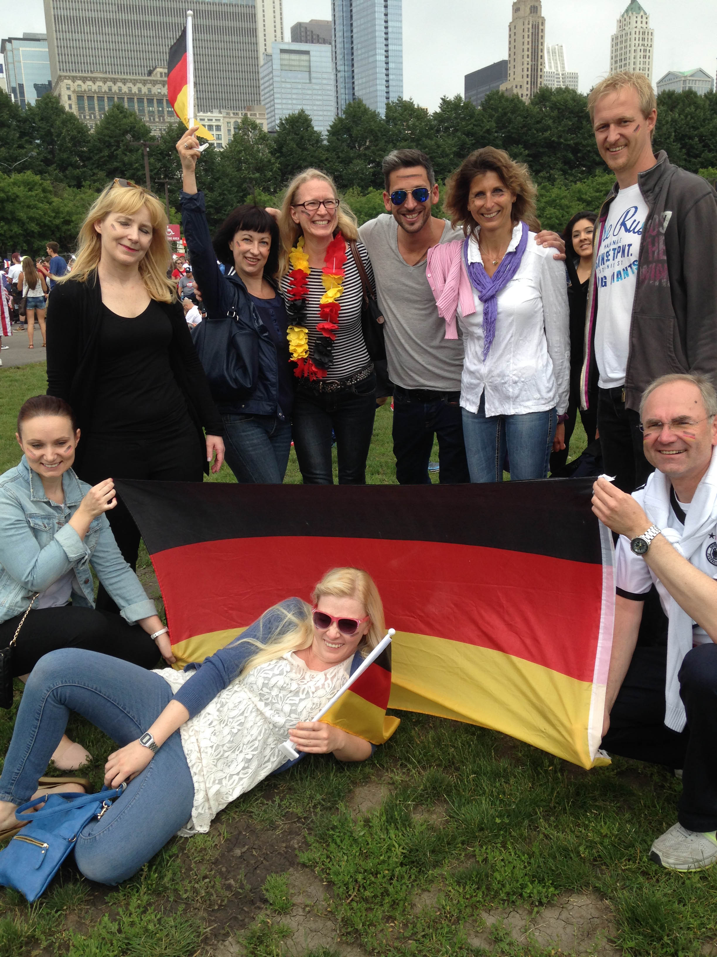 A Lufthansa flight crew on a layover in Chicago visited Grant Park to cheer on Germany against Team USA in World Cup soccer. (Credit: Regine Schlesinger/CBS)