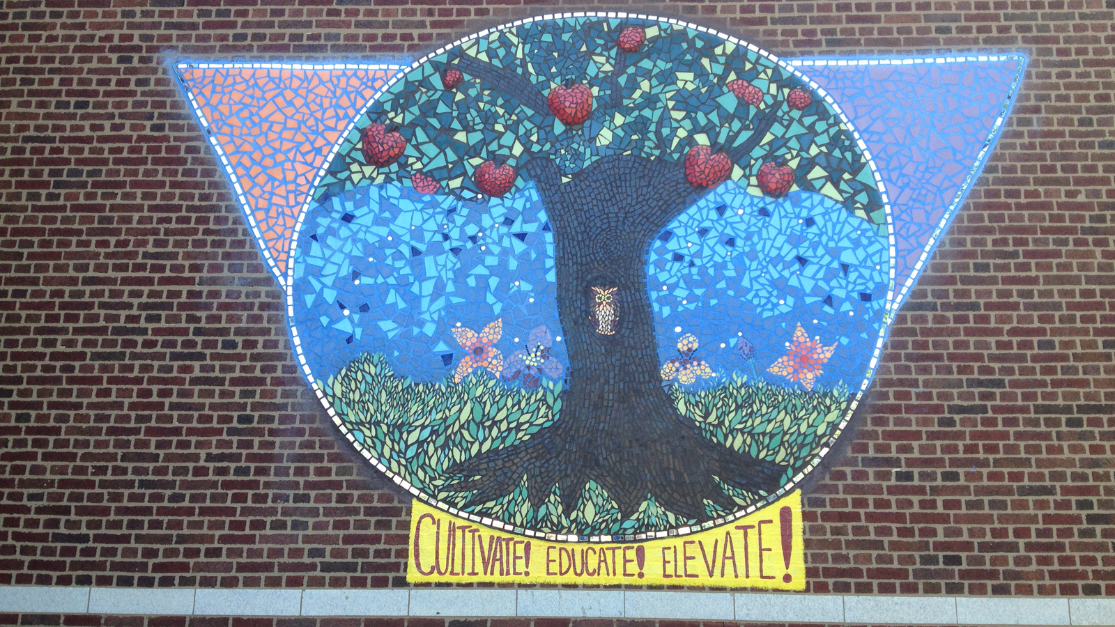 One of three murals created by students at Horace Mann Academy to send a positive message about their community. (Credit: Bernie Tafoya/CBS)