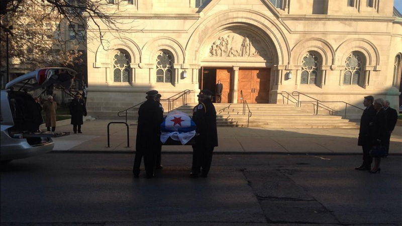Former Mayor Jane Byrne's casket is carried into St. Vincent de Paul Parish for her funeral. The city's first and only female mayor, Byrne died on Nov. 14, 2014, at the age of 81. (Credit: CBS)