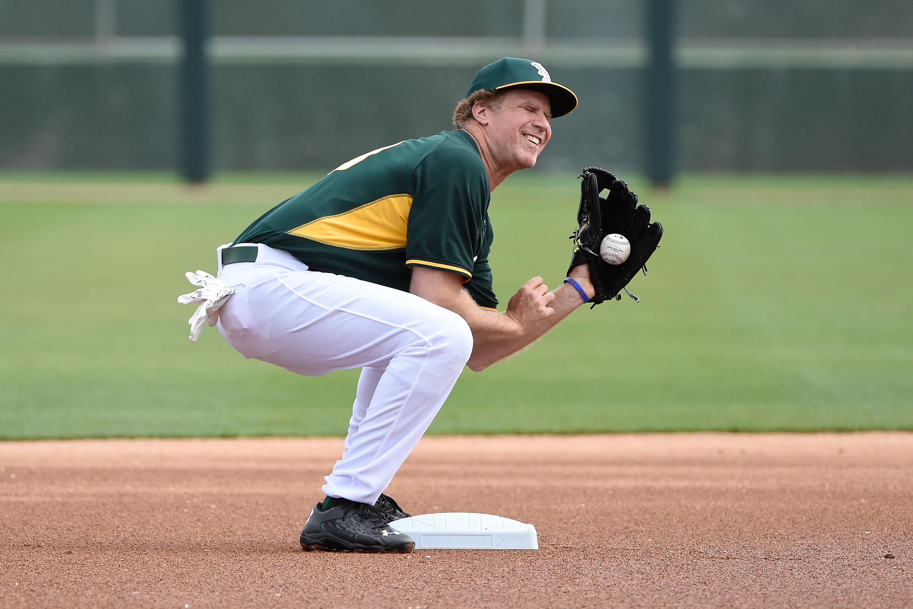 Actor Will Ferrell plays with the Oakland Athletics as they take on the Seattle Mariners as part of a new HBO special from Funny Or Die in partnership with Major League Baseball to support the fight against cancer at HoHoKam Stadium on March 12, 2015 in Mesa, Arizona. (Photo by Lisa Blumenfeld/Getty Images)
