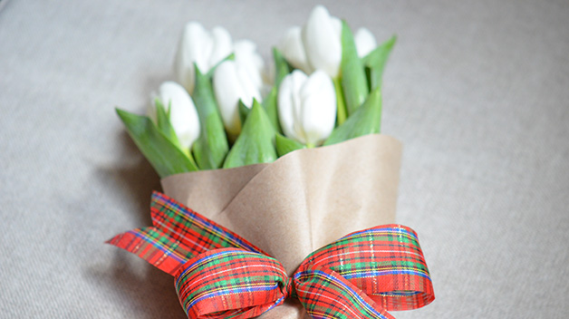Need a last-minute gift for the host or hostess of a party? Wrap a bouquet of flowers in butcher paper, then using a festive ribbon to tie it all together. (Photo courtesy of Marc J. Sievers.)