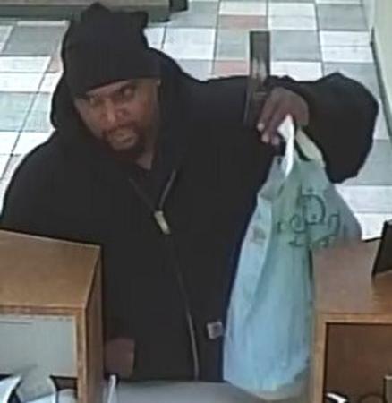 Surveillance photo of the suspect who robbed a bank Dec. in Morgan Park. Authorities believe this is the same man who robbed a bank Saturday in Bridgeview. | FBI