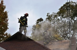 Firefighters battle a fire at a house in north suburban Evanston on Thursday. (Credit: Evanston Fire Department) 