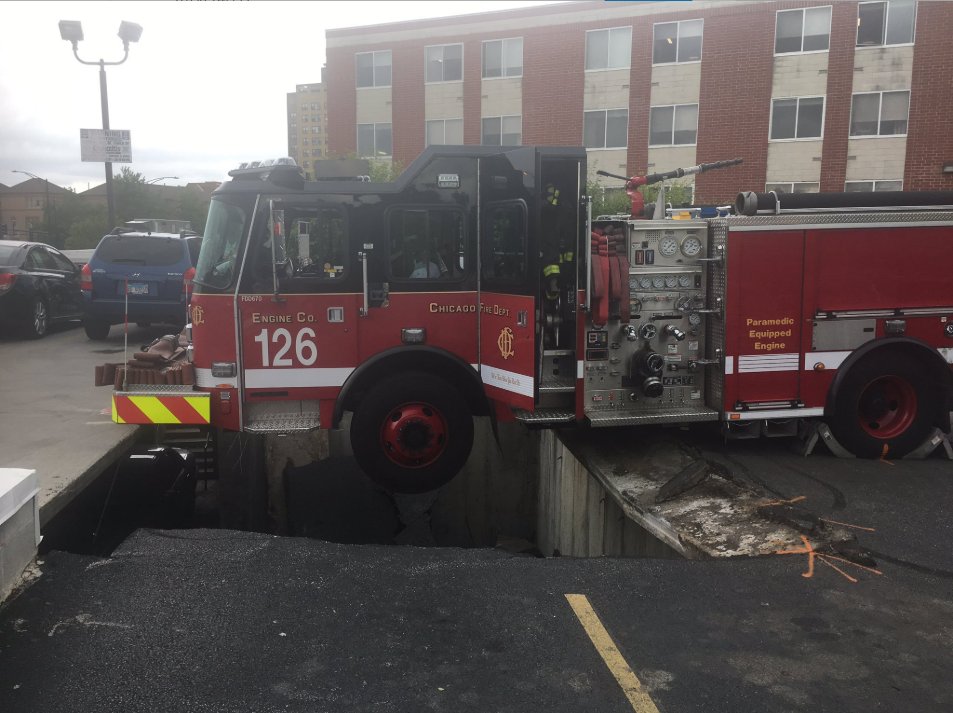 Crane Removes Chicago Fire Engine From Collapsed Parking Garage